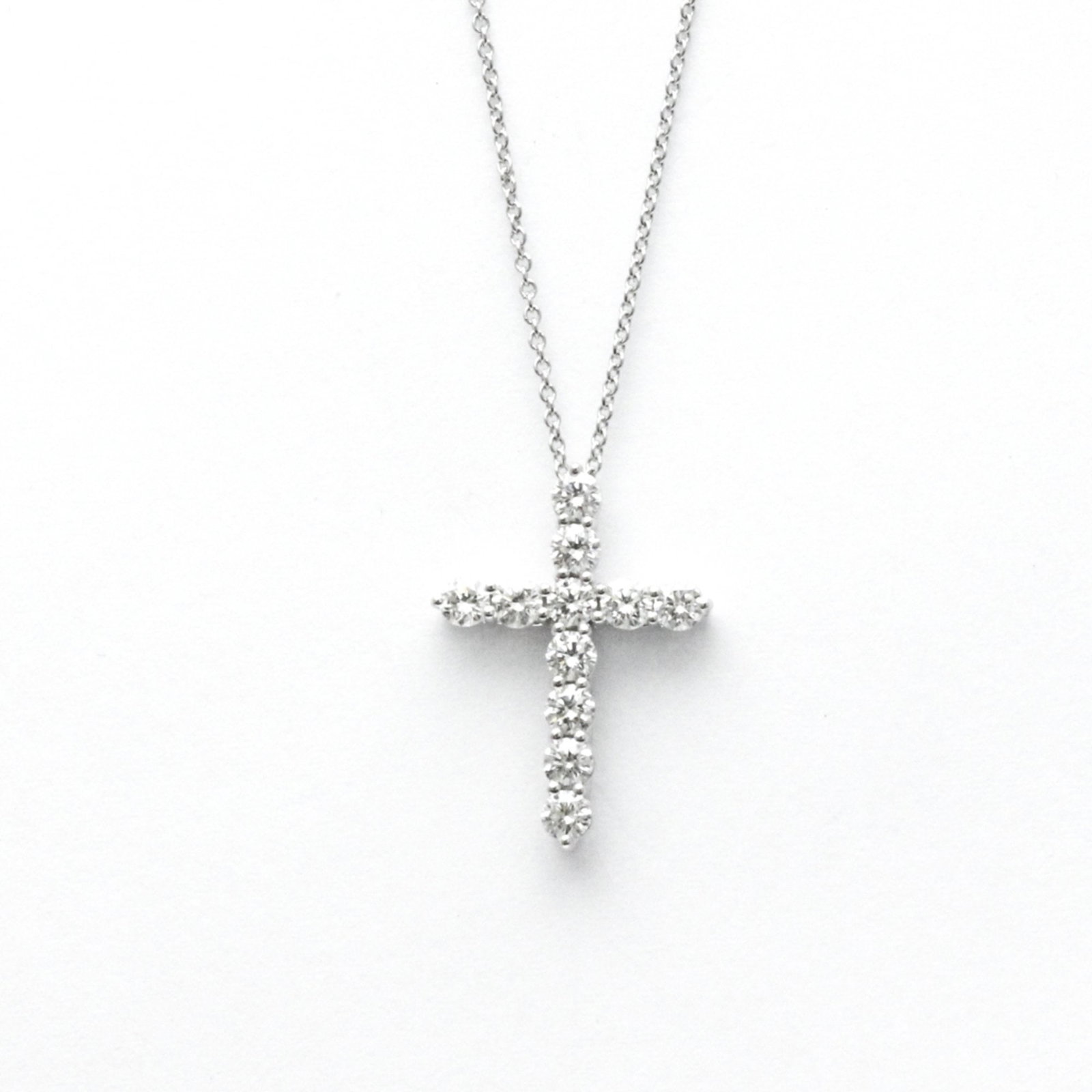 TIFFANY MEDIUM CROSS DIAMOND PENDANT NECKLACE: Tiffany Medium Cross Diamond Pendant Necklace Brand: Tiffany Type: Pendant necklace Material: Platinum Color: Silver Size: Neck Circumference: 41.5 cm / 16.33'' Pendant :21.5mm x 15.5mm / 0.84'' x 0.6