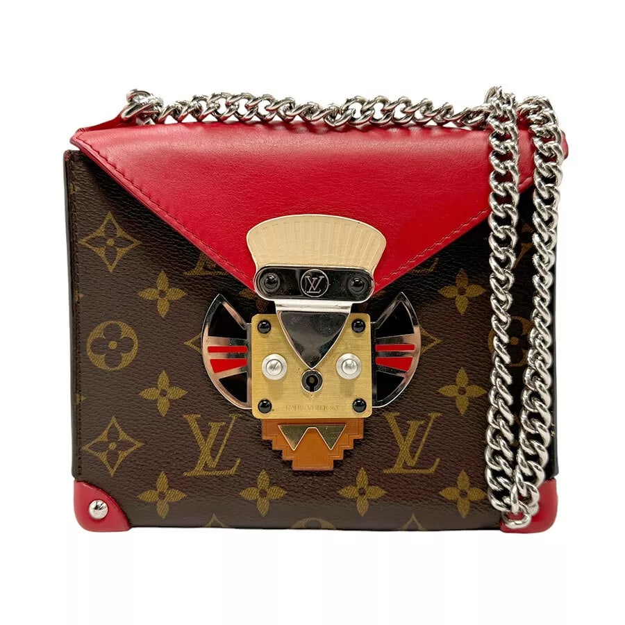 LOUIS VUITTON MONOGRAM POCHEETE MASK PM SHOULDER BAG: LOUIS VUITTON Monogram Pocheete Mask PM Shoulder Bag Brand: LOUIS VUITTON Type: Shoulder Bag Material: Monogram Canvas x Leather Color: Brown / Red Size: W:7.5inx H:6.3inx D:2.4in Shoulder Length: 45.