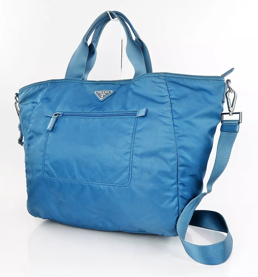 PRADA BLUE NYLON AND LEATHER 2-WAY HAND SHOULDER BAG: PRADA Blue Nylon and Leather 2-Way Hand Shoulder Bag Brand: PRADA Type: Shoulder Bag Material: Nylon Color: Blue Size: W 13.4 (bottom) x H 12.9 x D 7.1inch Accessories: None Accessories N