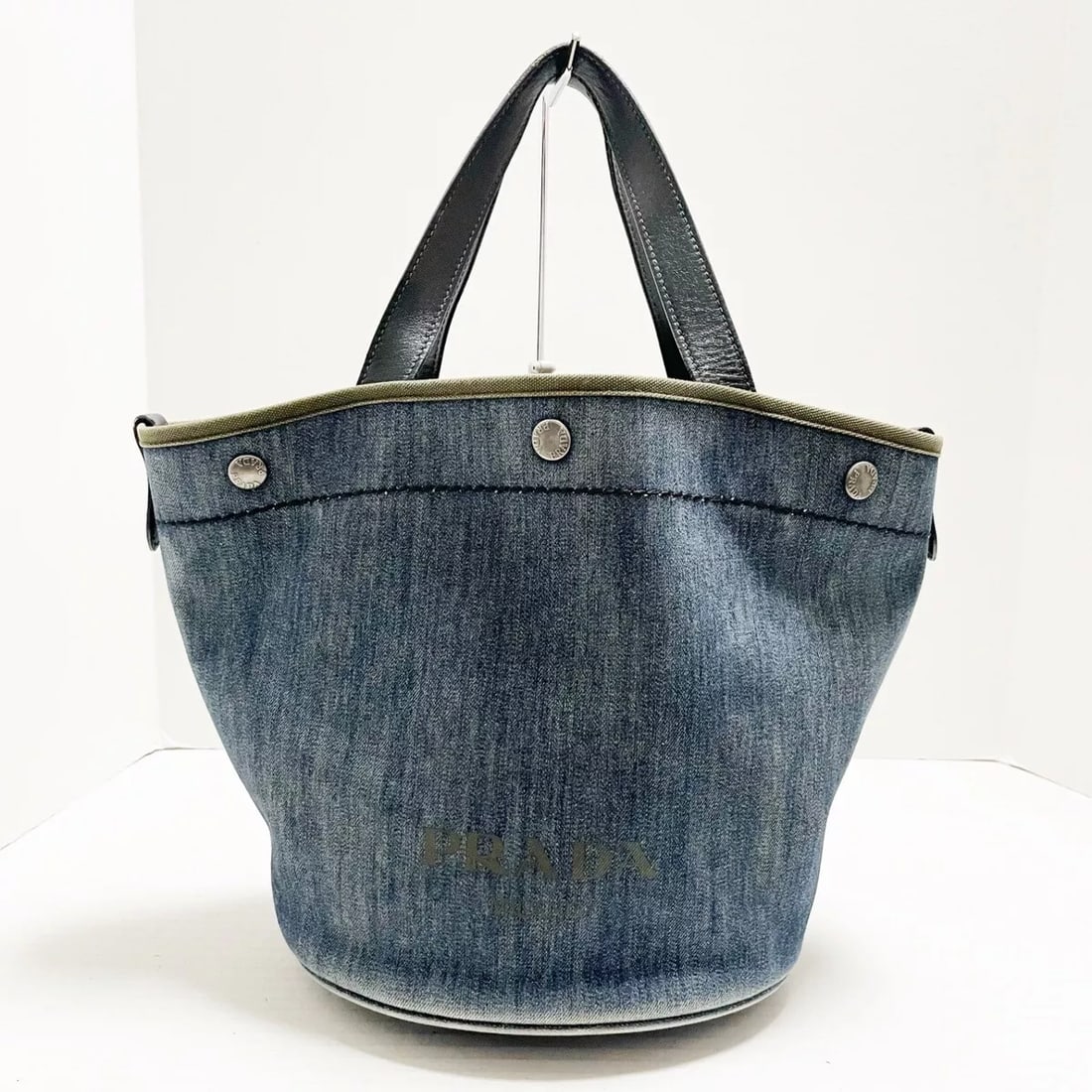 PRADA - BLUE KHAKI BLACK DENIM CANVAS LEATHER TOTE BAG: PRADA - Blue Khaki Black Denim Canvas Leather Tote Bag Brand: PRADA Type: Tote Bag Material: Denim, Canvas, Leather Color: Blue, Khaki, Black Size: Height: 9.84 inch (25 cm) Width: 9.06 inch (23 cm) -