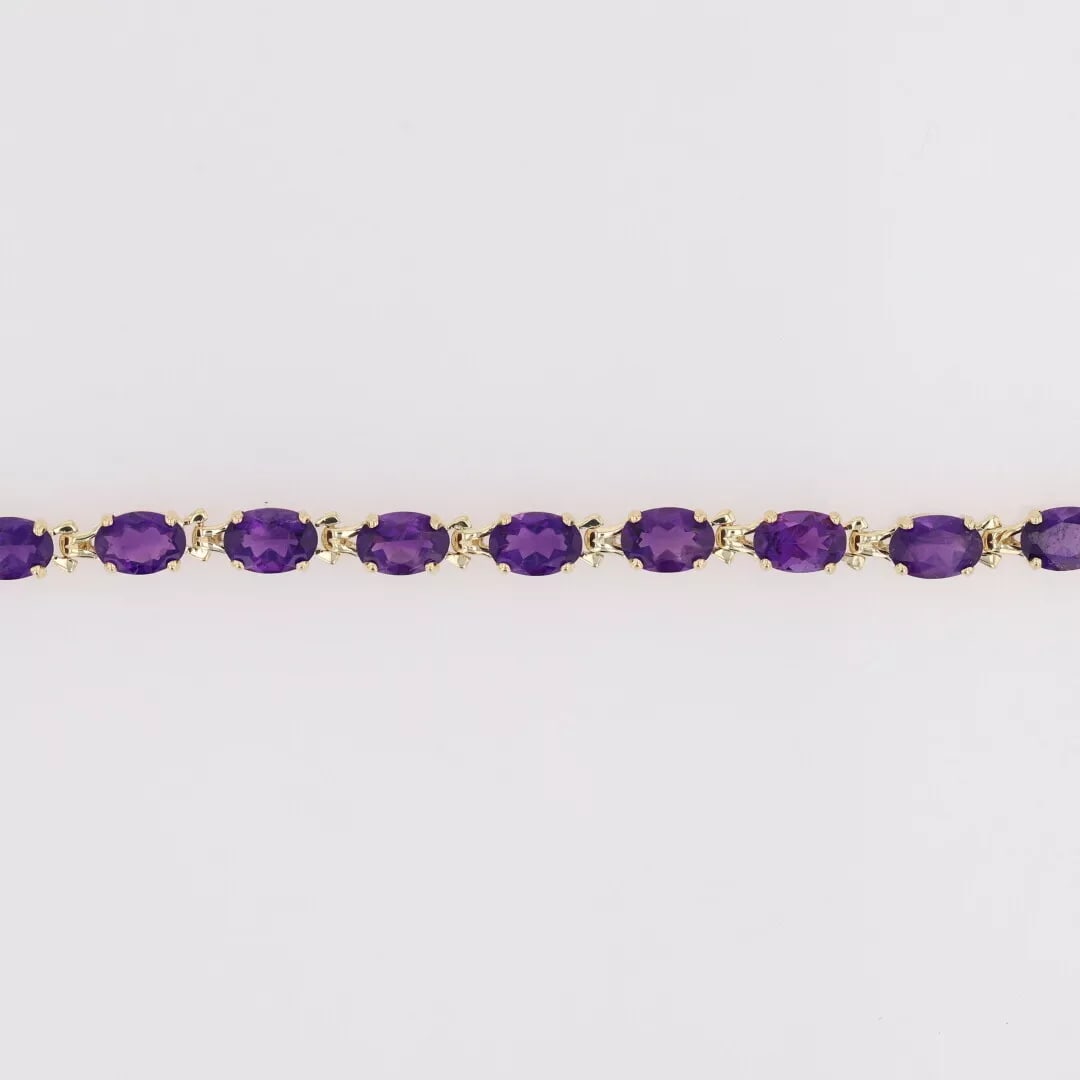 OVAL AMETHYST TENNIS BRACELET 14K YELLOW GOLD: Oval Amethyst Tennis Bracelet 14k Yellow Gold Brand: Unbranded Type: Bracelet Material: Yellow Gold Color: None Size: Bracelet Measurement: 7.25" Length / 4.27mm Width Accessories: None A