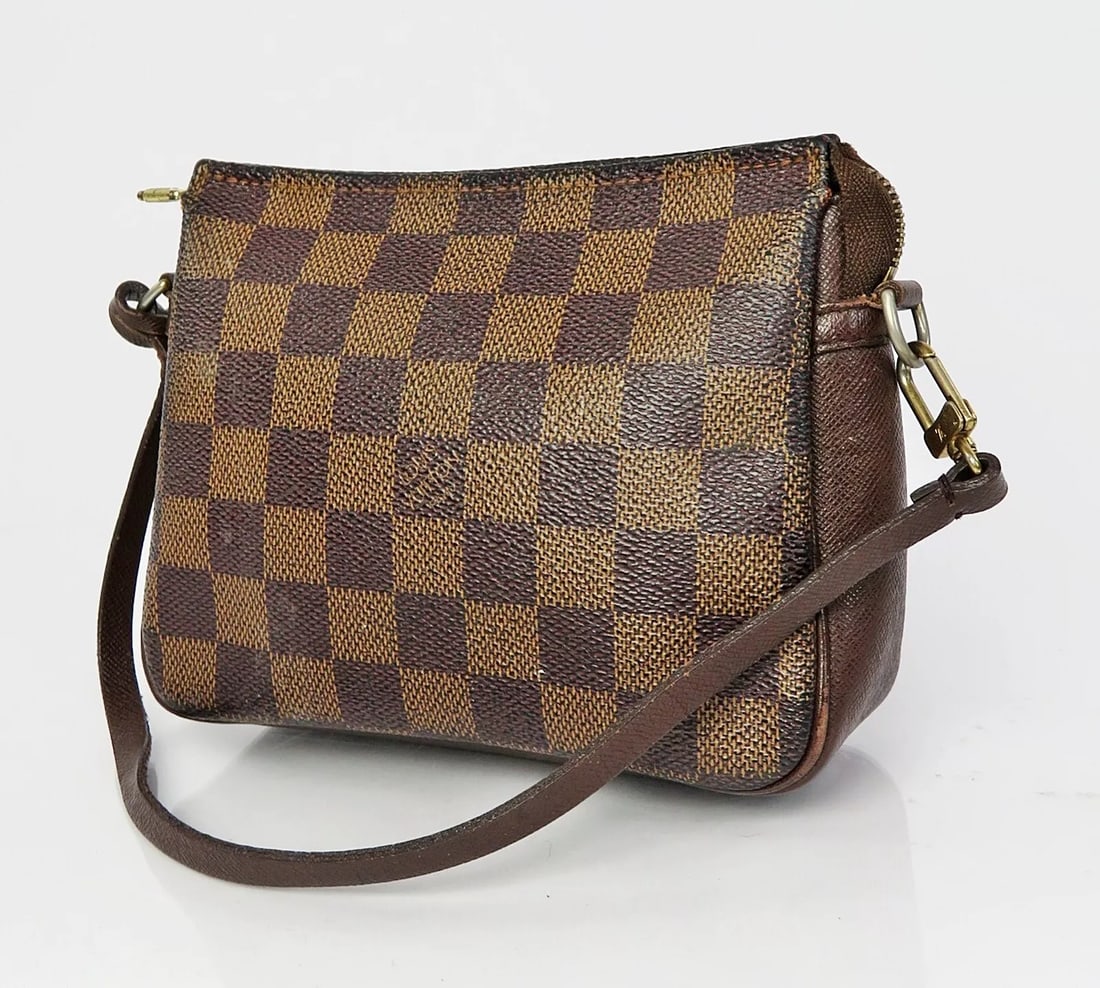 LOUIS VUITTON TROUSSE DAMIER EBENE COSMETICS POUCH BAG: LOUIS VUITTON Trousse Damier Ebene Cosmetics Pouch Bag Brand: Louis Vuitton Type: Cosmetic Bags Material: Coated Canvas Color: Brown Size: Size in inches (approx.):W 6.3 x H 5.1 x D 1.9Handle drop
