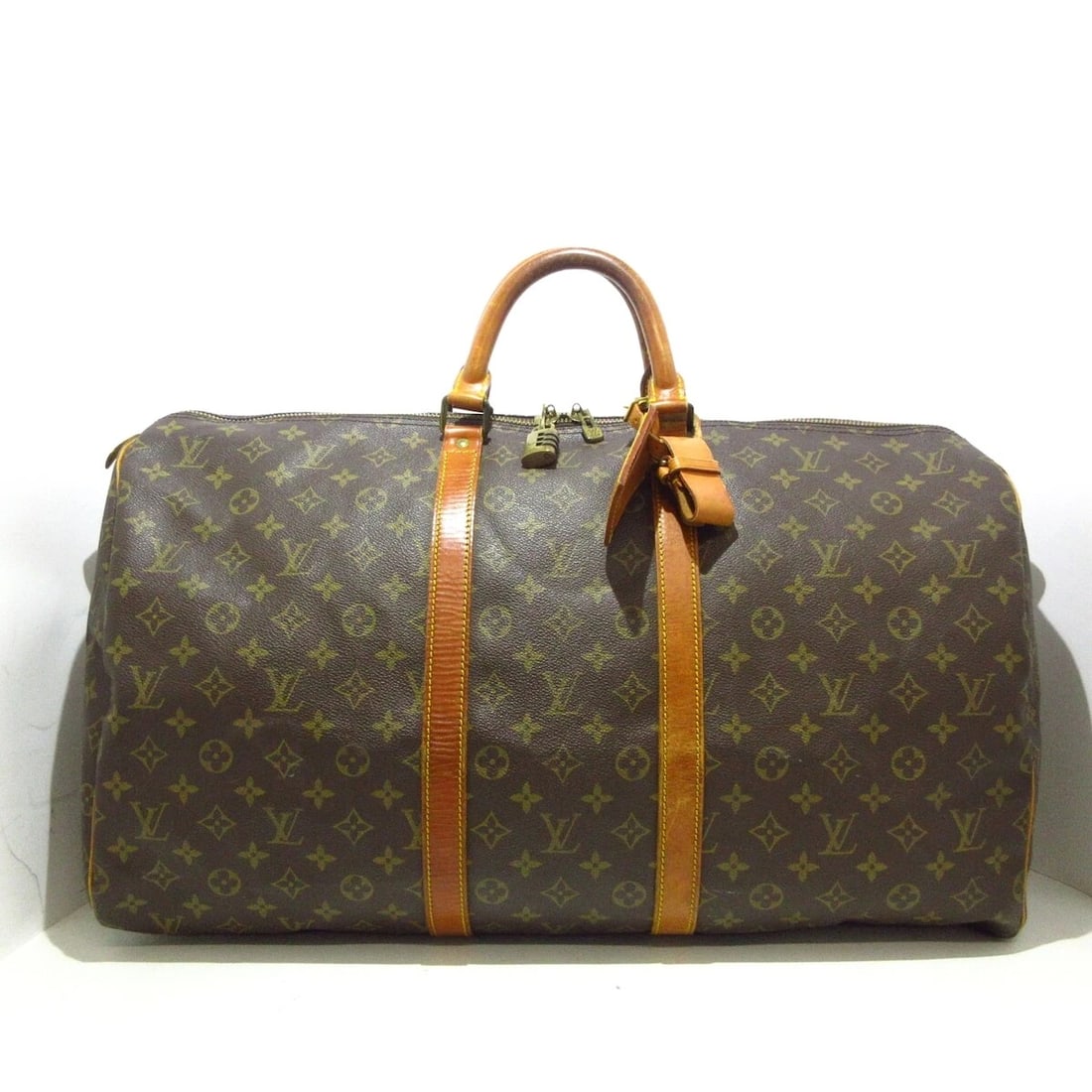 LOUIS VUITTON KEEPALL 55 MONOGRAM BOSTON BAG: LOUIS VUITTON Keepall 55 Monogram Boston Bag Brand: LOUIS VUITTON Type: Boston Bag Material: Monogram Canvas Color: Monogram Size: Height: 12.2 inch (31 cm)Width: 21.65 inch (55 cm)Depth: 9.45 inch (2