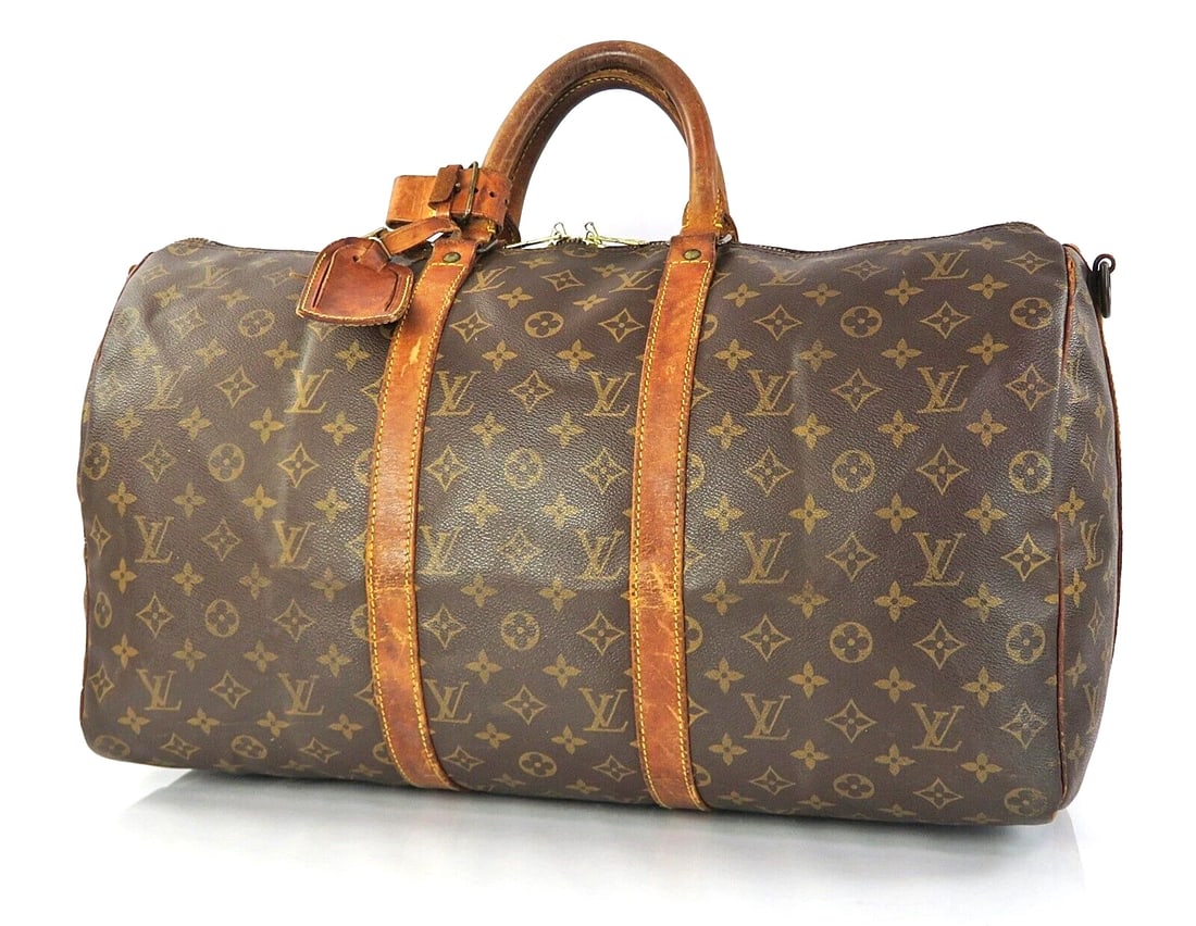 LOUIS VUITTON KEEPALL BANDOULIERE 50 MONOGRAM CANVAS DUFFEL BAG: LOUIS VUITTON Keepall Bandouliere 50 Monogram Canvas Duffel Bag Brand: Louis Vuitton Type: Duffle Material: Coated canvas Color: Browns Size: Size in inches (approx.):W 19.7 x H 10.6 x D 8.25Handle dr