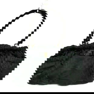 SALVATORE FERRAGAMO VARA LEATHER SHOULDER BAG: Salvatore Ferragamo Vara Leather Shoulder Bag Brand: Salvatore Ferragamo Type: Shoulder Bag Material: Nylon, Patent Leather Color: Black Size: Height: 9.45 inch (24 cm) Width: 11.02 inch (28 cm) -