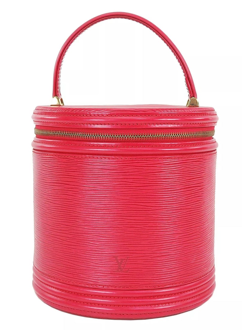LOUIS VUITTON CANNES RED EPI LEATHER VANITY BAG: LOUIS VUITTON Cannes Red Epi Leather Vanity Bag Brand: Louis Vuitton Type: Cosmetic Bags Material: Leather Color: Red Size: Size in inches (approx.):W 7.5 x H 7.7 x D 7.1Handle drop in inches:3.5