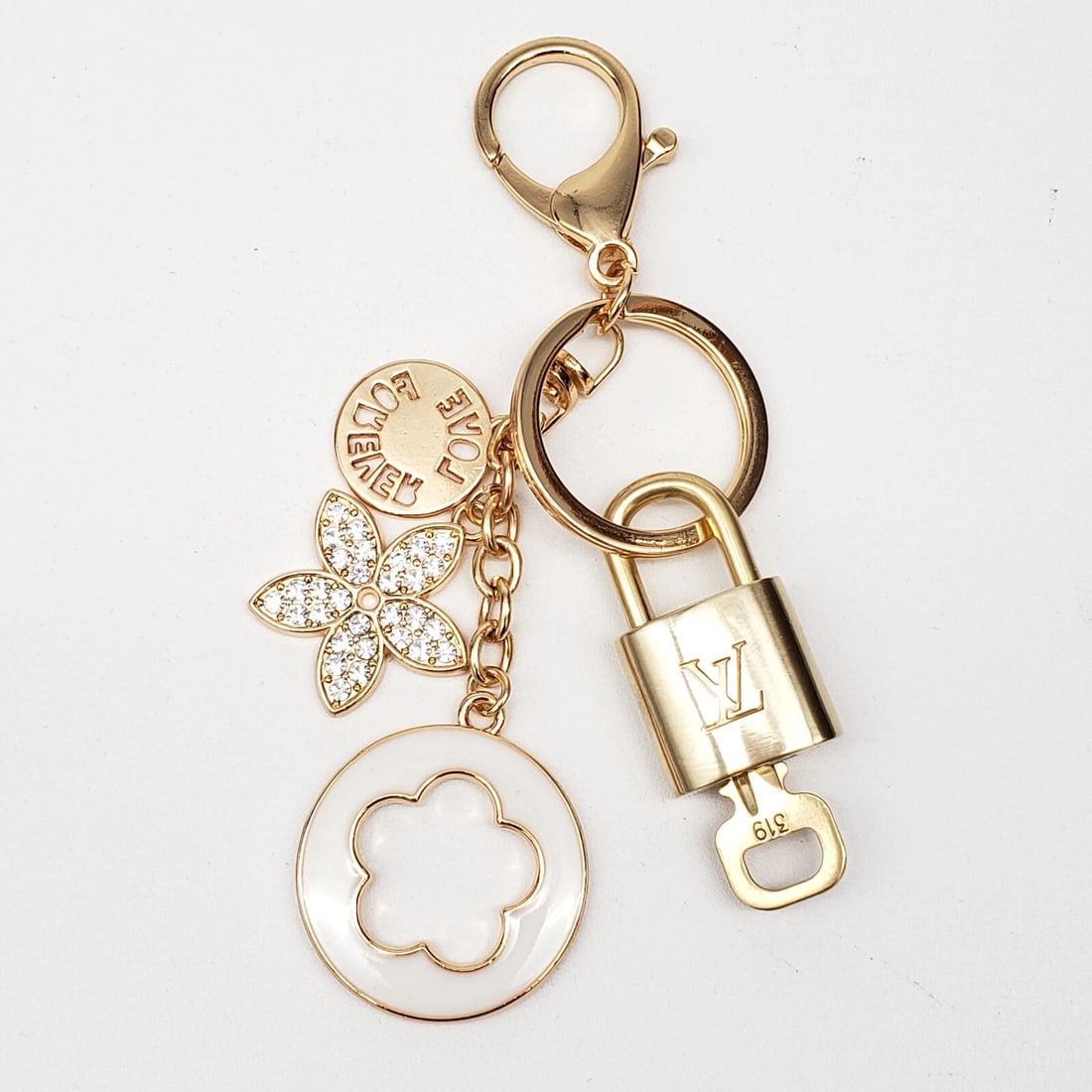 LOUIS VUITTON LOCK & KEY WITH UNBRANDED BAGCHARM, KEYCHARM, KEYCHAIN: Louis Vuitton Lock & Key with unbranded Bagcharm, Keycharm, Keychain Brand: Louis Vuitton Type: Key Chain Material: None Color: Multicolor Size: None Accessories: None Accessories Notice: