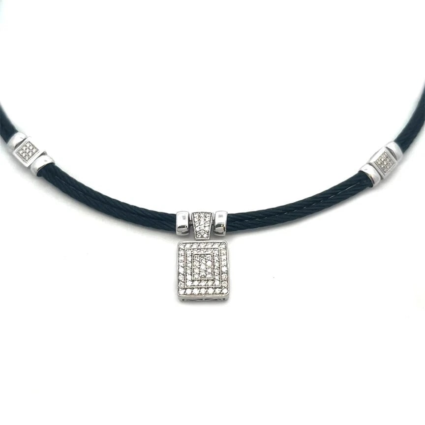 CHARRIOL DIAMOND GOLD NECKLACE ENHA: Charriol Diamond Gold Necklace Enha Brand: Charriol Type: Necklace Material: 18k white gold and steel cable Color: White Size: 16.5" long x 4mm wide x 5mm high Pendant: 21mm long w/bail x 12mm wid