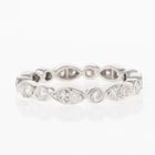 TIFFANY & CO. ROUND CUT DIAMOND ETERNITY BAND RING: Tiffany & Co. Round Cut Diamond Eternity Band Ring Brand: Tiffany & Co. Type: Ring Material: Metal Platinum Color: Diamond Color Grade: I - J Clarity: Diamond Clarity Grade: Slightly Included (SI1