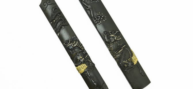 KINKO KODZUKA AND KOGAI SET (FUTATOKOROMO) (MGJ347): Kinko Kodzuka and Kogai set (Futatokoromo) (MGJ347) Description: Kinko Kodzuka and Kogai set (Futatokoromo) in shakudo. Kodzuka decorated with a mounted samurai in armor under a cherry tree; Kogai als