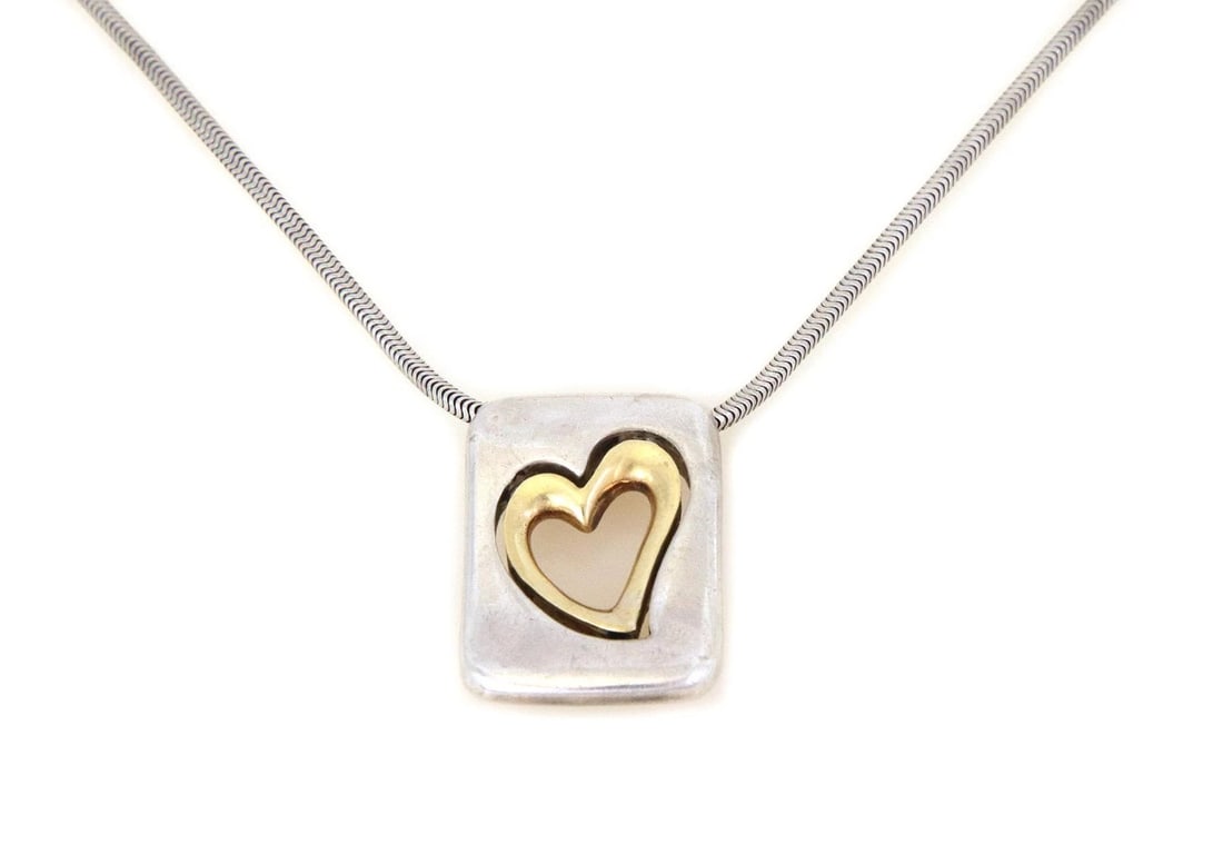 VINTAGE CARTIER STERLING 18K GOLD PENDANT: Vintage Cartier Sterling 18k Gold Pendant Brand: Cartier Type: Necklace Material: sterling silver 18k yellow gold Color: None Size: Measurement: chain: 20.5" long x 1.5mm thick Pendant: 1.05" long