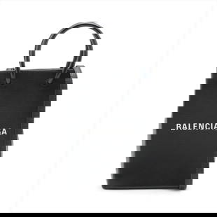 BALENCIAGA SHOPPING PHONE HOLDER LEATHER 2 WAY HANDBAG: Balenciaga Shopping phone holder Leather 2 Way Handbag Brand: Balenciaga Type: Hand bag Material: Leather Color: Black Size: Size(Inch) Height:7.1inch Length:4.7inch Depth:1.6inch Handle height:2.