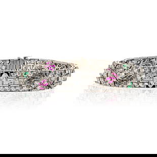 ART DECO PLATINUM DIAMOND, RUBY, EMERALD AND ONYX BRACELET: Art Deco Platinum Diamond, Ruby, Emerald And Onyx Bracelet Metal Type: Platinum Condition: Excellent Size: Measurements: L: 7 inches W: 11mm Description: This is an elegant platinum diamond, emeral