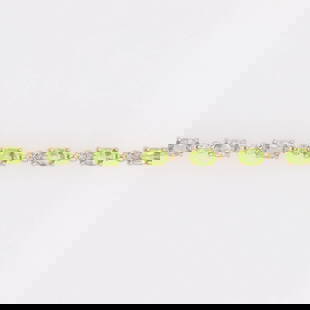 OVAL PERIDOT AND DIAMOND TENNIS BRACELET: Oval Peridot and Diamond Tennis Bracelet Brand: Unbranded  Type: Bracelet  Material: Metal Yellow Gold  Color: Main Stone Color: Yellowish Green, Clarity Gemstone Clarity Grade: Slightly Included  Siz