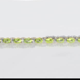 PERIDOT WITH DIAMOND ACCENTS BRACELET: Peridot with Diamond Accents Bracelet Brand: Unbranded  Type: Bracelet  Material: Metal Yellow Gold  Color: Main Stone Color: Yellowish Green, Clarity Gemstone Clarity Grade: Slightly - Moderately Inc