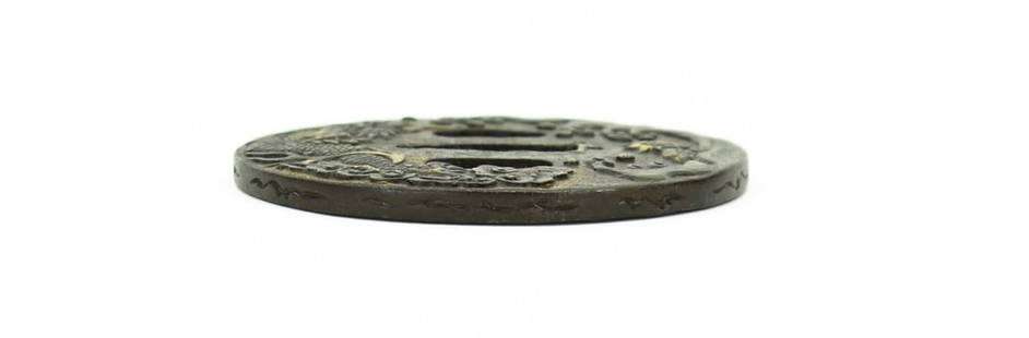 IRON TSUBA: Iron Tsuba Description: Iron Tsuba. Water dragon in turbulent water with gold highlights. Reverse decorated with bamboo also with gold highlights. Signed in Sosho (grass writing): Kawamura Jakushi Hiz