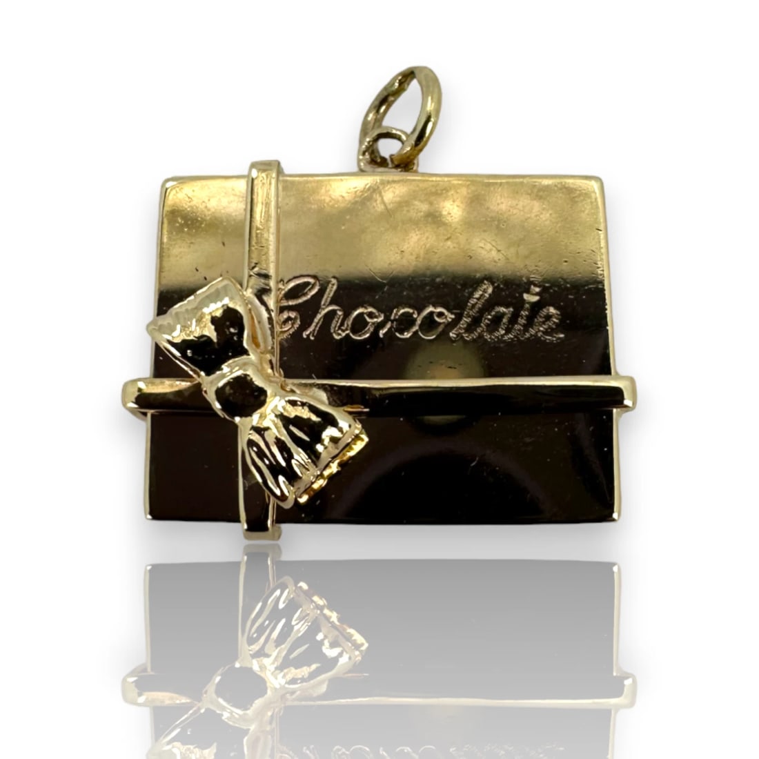 CHOCOGIFT BOX 14K SOLID GOLD CHARM PENDANT: ChocoGift Box 14k Solid Gold Charm Pendant Brand: Unbranded Type: Charm Material: Metal Color: Yellow Size: Length x Width - 0.8" x 0.6 Accessories: None Accessories Notice: When purchasin