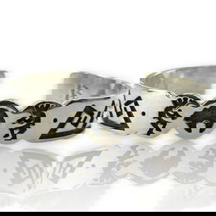 MICHAEL KABOTIE HOPI BANGLE BRACELET: Michael Kabotie Hopi Bangle Bracelet Brand: Michael Kabotie Type: Bracelet Material: Metal Color: Silver Size: Length - 6" Width - 12.25mm Accessories: None Accessories Notice: When purcha