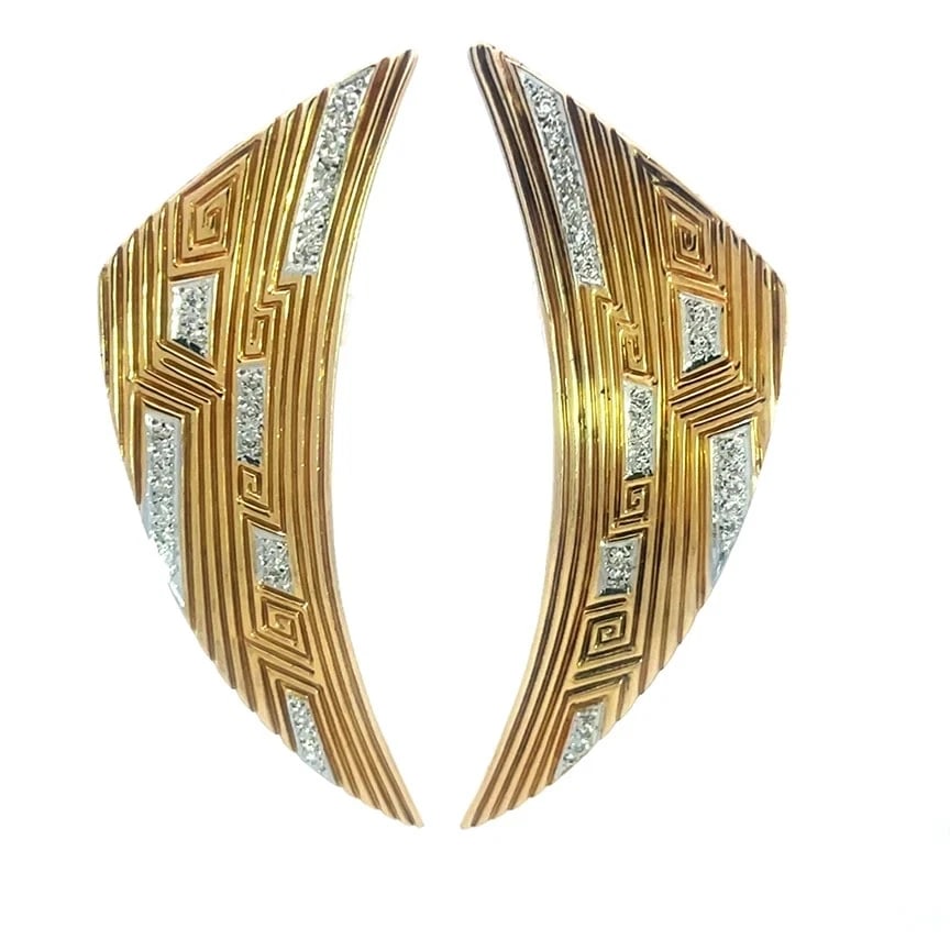 ERTE GOLD DIAMOND EARRINGS: Erte Gold Diamond Earrings Brand: Erte Type: Earrings Material: 14k yellow and white gold Color: Yellow Size: Measurement: 2.70" long x 26" wide x 2mm thick Accessories: None Accessories N