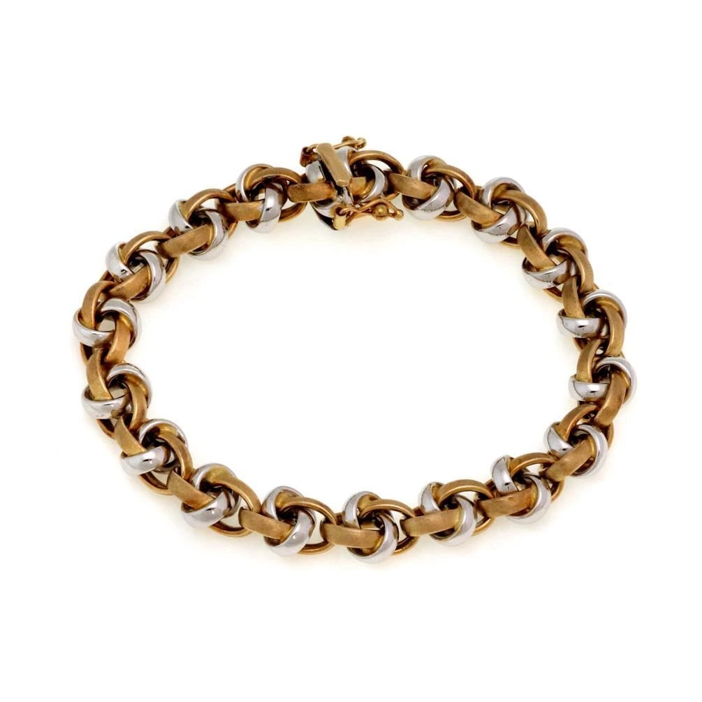 18K TWO TONE GOLD FANCY BRACELET: 18k Two Tone Gold Fancy Bracelet Brand: Unbranded Type: Bracelet Material: 18k yellow and white gold Color: None Size: Measurement: 7.5" long x 0.35" wide x 0.21" high Accessories: None Ac