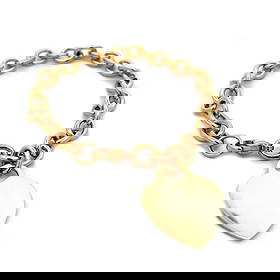 TIFFANY & CO. HEART CHARM BRACELET: Tiffany & Co. Heart Charm Bracelet Brand: Tiffany & Co. Type: Bracelet Material: 18k yellow gold Color: Yellow Size: Measurement: 8" x 7mmx 7mm Accessories: None Accessories Notice: When p