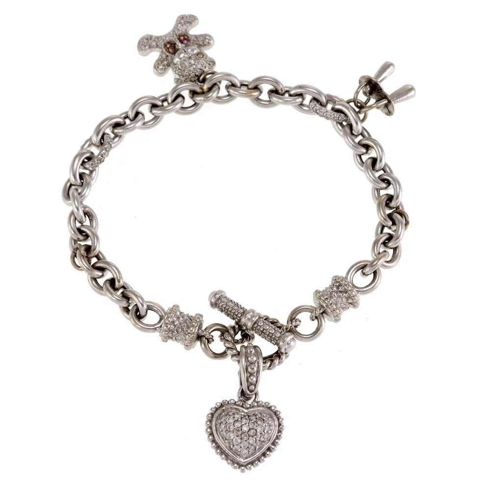 DIAMOND CHARM BRACELET IN 14K WITH BEAR PACIFIER: Diamond Charm Bracelet In 14k With Bear Pacifier Brand: Unbranded Type: Charm Bracelet with Charms Material: 14k white gold Color: None Size: Measurement: 7" long x 0.23" x 0.23" Charms: 0.55" tal