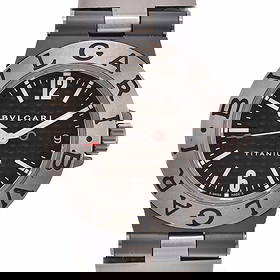 BVLGARI DIAGONO TITANIUM DATE CARBON DIAL QUARTZ WATCH: BVLGARI Diagono Titanium Date Carbon Dial Quartz Watch Brand: BVLGARI Type: Wristwatch Material: Band Material Rubber / Titanium, Case Material Titanium Color: Dial Color Black/brown (carbon), Case