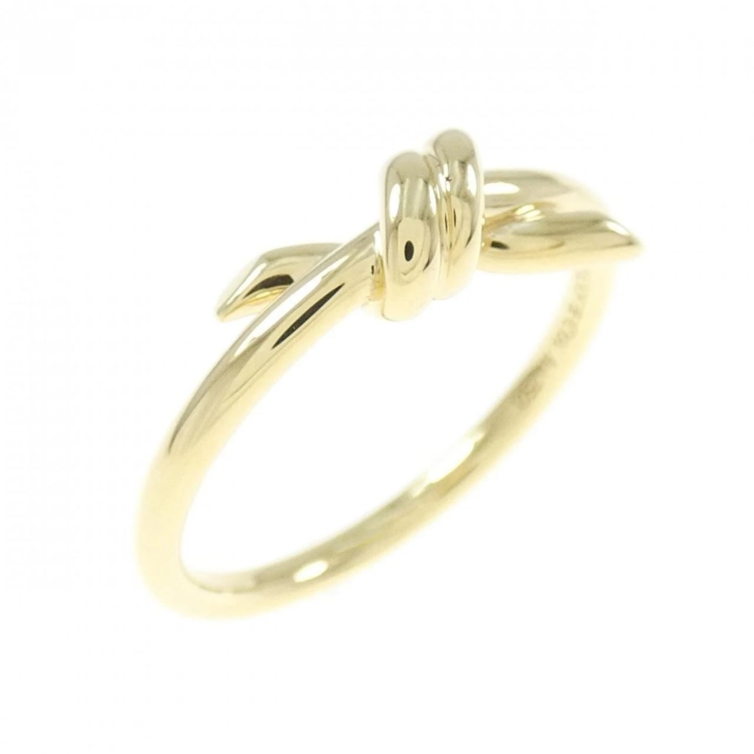 TIFFANY KNOT RING: Tiffany Knot Ring Brand: Tiffany Type: Ring Material: 750 Yellow Gold, Color: None Size: 6 US Accessories: None Accessories Notice: When purchasing pre-owned goods, please refer to the pho