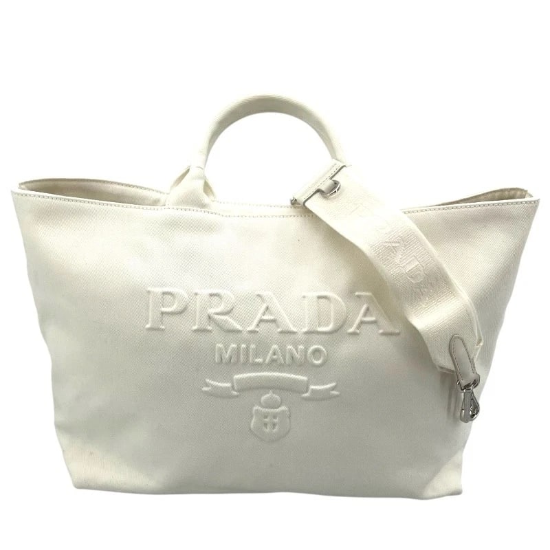 PRADA 2WAY HAND SHOULDER BAG: PRADA 2WAY hand Shoulder Bag Brand: PRADA Type: Shoulder Bag Material: canvas Color: white Size: W17.7 x H11.8x D5.9inch Shoulder:31.1inch Accessories: None Accessories Notice: When purcha