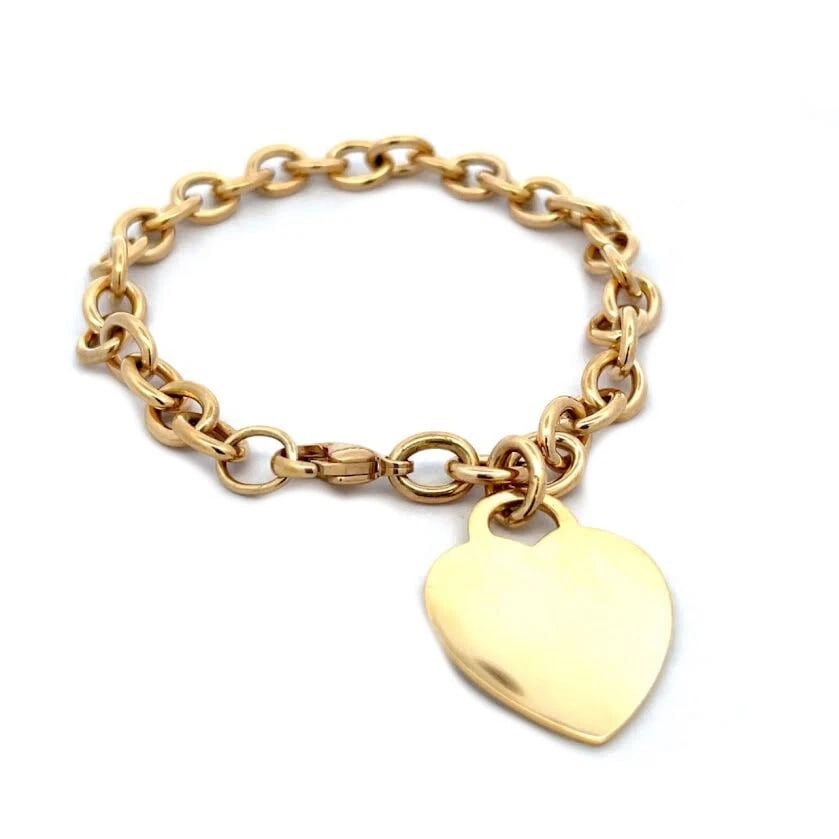 TIFFANY & CO. HEART CHARM BRACELET 18K YELLOW GOLD: Tiffany & Co. Heart Charm Bracelet 18k Yellow Gold Brand: Tiffany & Co. Type: Bracelet Material: 18k yellow gold, Stone Creation Natural Color: Yellow Size: Measurement: 8" x 7mmx 7mm Hearts: 27mm
