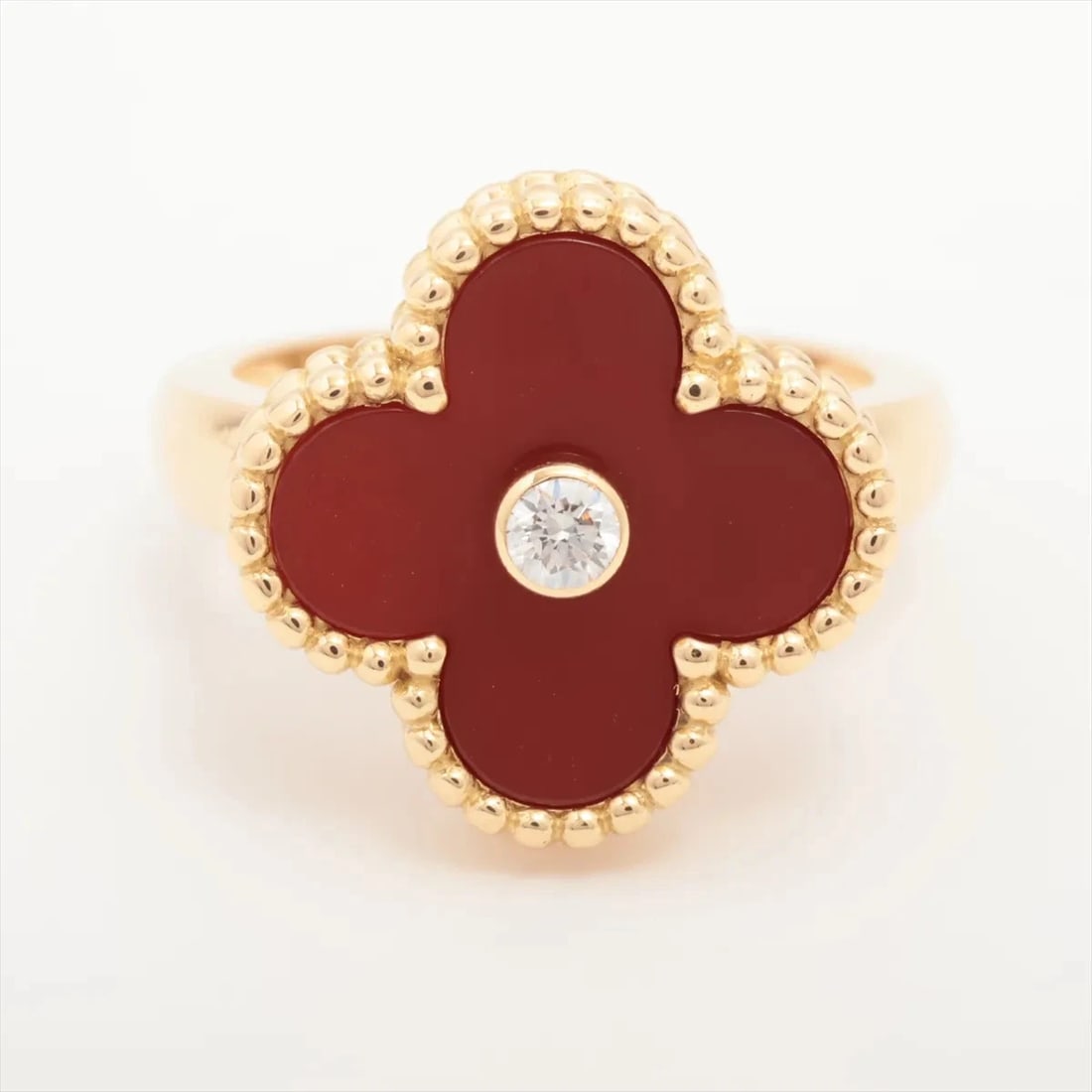 VAN CLEEF & ARPELS VINTAGE ALHAMBRA CARNELIAN DIAMOND RING: Van Cleef & Arpels Vintage Alhambra Carnelian diamond Ring Brand: Van Cleef & Arpels Type: Ring Material: 750(YG) Main Stone Natural Color: Not Specified Size: 3.75 US Accessories: None Ac