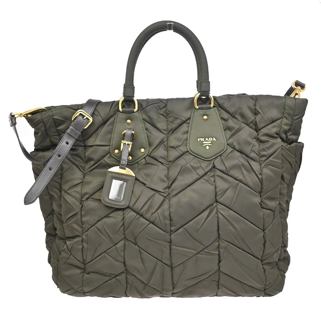 PRADA LOGO TESSUTO 2-WAY HAND TOTE SOULDER BAG: PRADA Logo Tessuto 2-Way Hand Tote Soulder Bag Brand: PRADA Type: Hand Bag Material: Nylon Color: Khaki Size: W 18.1 x H 9.8 x D 5.9 " (approx.) HANDLE DROP ( inch /cm ) 5.1 "/ 13 cm (approx.) Ac