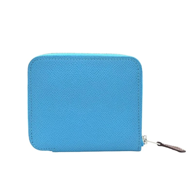 HERMES AZAP COMPACT CELESTE SHW EPSOM: HERMES Azap Compact Celeste SHW Epsom Brand: HERMES Type: TypeWallet Material: Epson Color: Celeste Sv Hardware Size: W: 11cm / H: 10cm / D: 1.5cm Accessories: None Accessories Notice: Whe