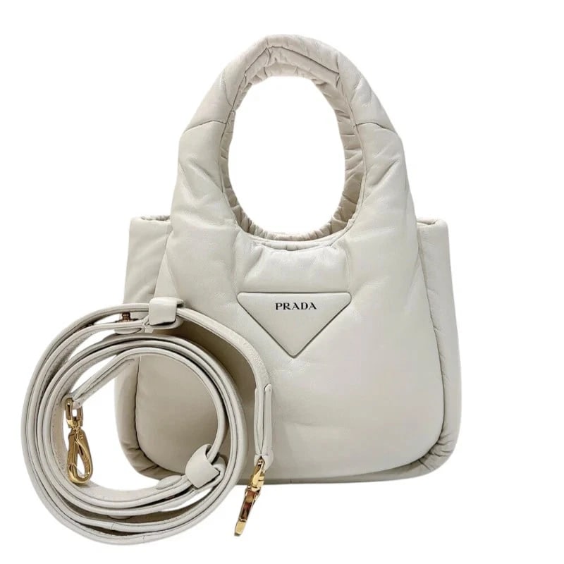 PRADA SOFT PADDED 2WAY BAG: PRADA Soft Padded 2WAY Bag Brand: PRADA Type: Handbag Material: Soft Padded Nappa Leather Color: White/GD Hardware Size: W: 22cm / H: 16cm / D: 7.5cm Accessories: None Accessories Notice: