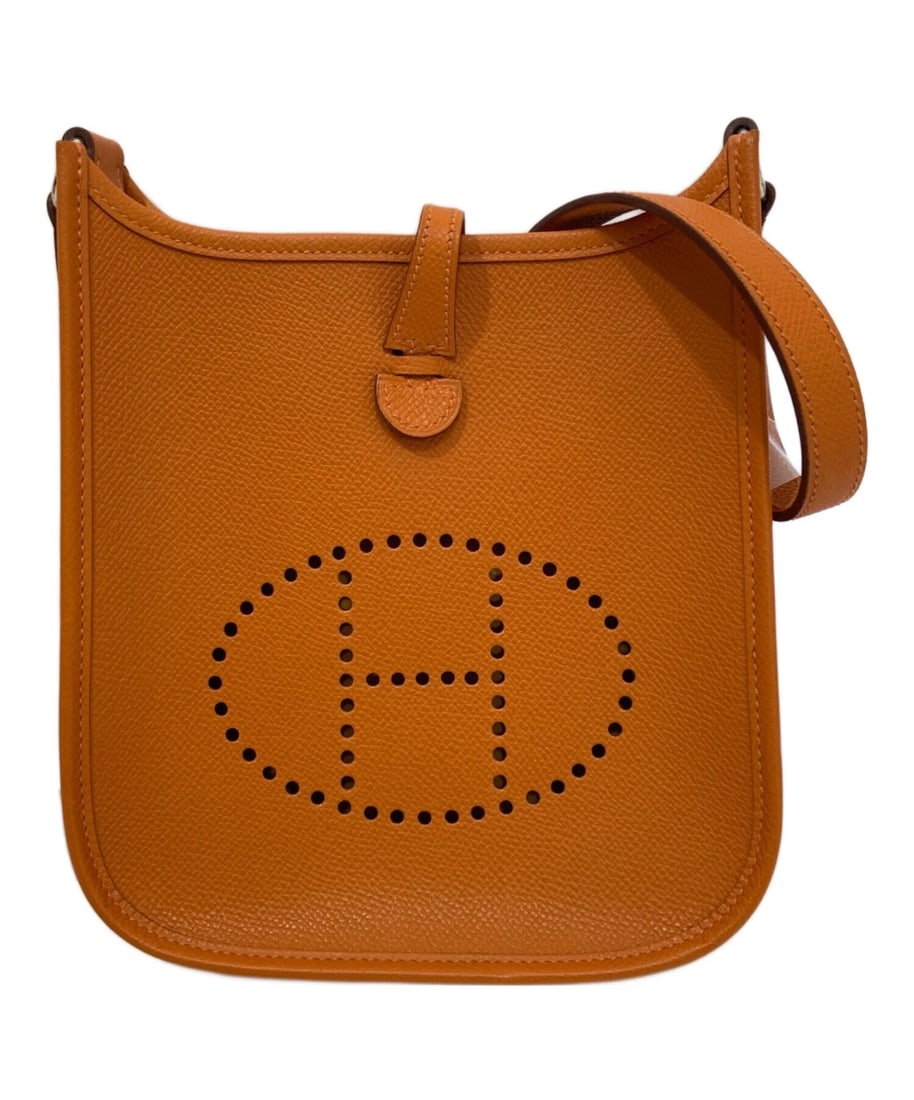 HERMES EVELYNE TPM SHOULDER BAG: HERMES Evelyne TPM Shoulder Bag Brand: HERMES Type: Handbag Material: Vaux Epsom Color: Orange Size: H:18cm / W:17cm / D:5.5cm Accessories: None Accessories Notice: When purchasing pre-owned
