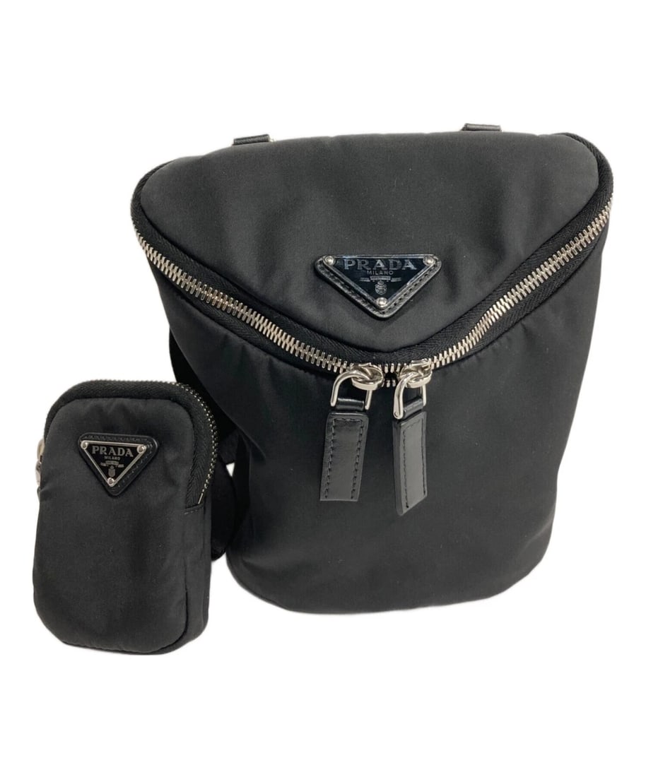 PRADA RE-NYLON AND LEATHER TRIANGLE SHOULDER BAG: PRADA Re-Nylon and Leather Triangle Shoulder Bag Brand: PRADA Type: Handbag Material: Nylon Color: Black Size: H:20.0cm / W:16.1cm / D:13.0cm Accessories: None Accessories Notice: When pur