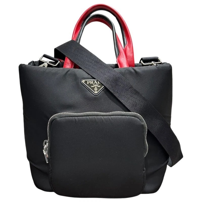 PRADA BLACK AND RED NYLON/LEATHER TOTE: PRADA Black and Red Nylon/Leather Tote Brand: PRADA Type: Handbag Material: Nylon/Leather Color: Black x Red Size: W: 28cm / H: 29cm / D: 13cm / Shoulder: 64-111cm Accessories: None Access