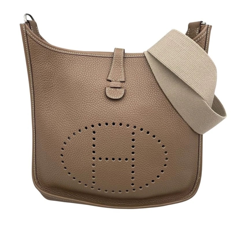 HERMES EVELYNE 1 PM ?I STAMP ETOUPE SHW CLEMENCE LEATHER: HERMES Evelyne 1 PM ?I Stamp Etoupe SHW Clemence Leather Brand: HERMES Type: Handbag Material: Taurillon Color: Etoupe SV Hardware Size: W: 29cm / H: 30cm / D: 8cm / Shoulder: 84cm 