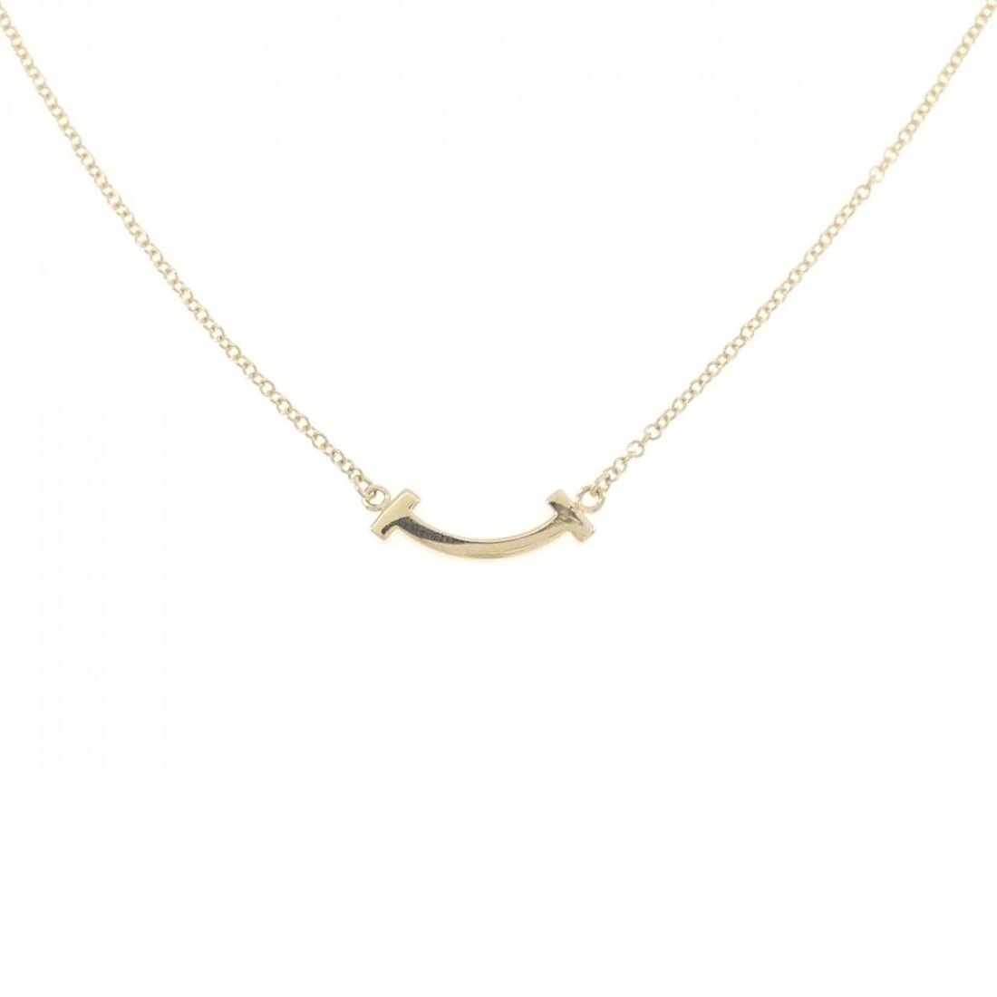 TIFFANY T SMILE MINI NECKLACE: Tiffany T Smile mini Necklace Brand: Tiffany Type: Necklace Material: 750 Yellow Gold Color: Yellow Gold Size: 41/46cm Accessories: None Accessories Notice: When purchasing pre-owned goods,