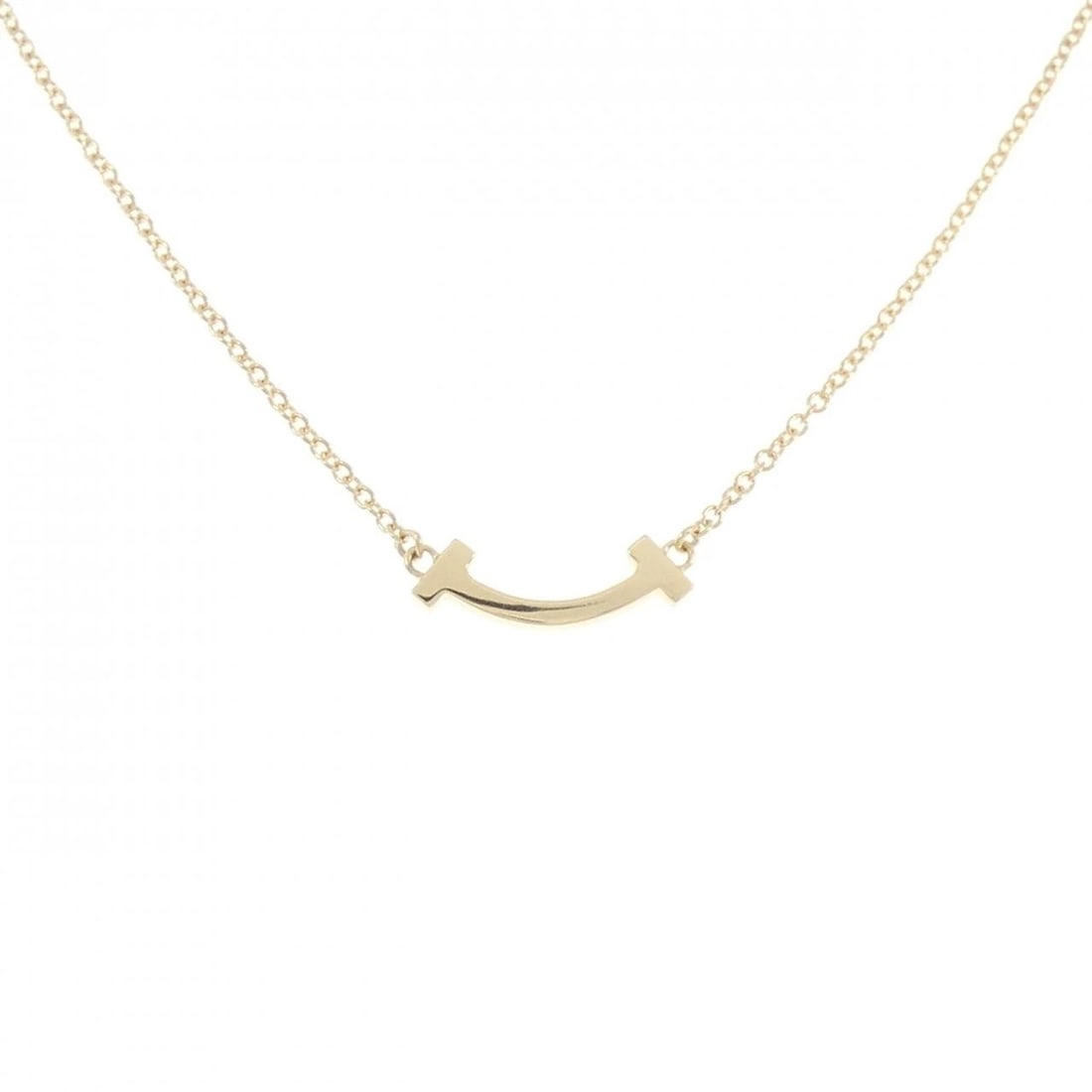 TIFFANY T SMILE MINI NECKLACE: Tiffany T Smile mini Necklace Brand: Tiffany Type: Necklace Material: 750 Yellow Gold Color: Yellow Gold Size: 41/46cm Accessories: None Accessories Notice: When purchasing pre-owned goods,