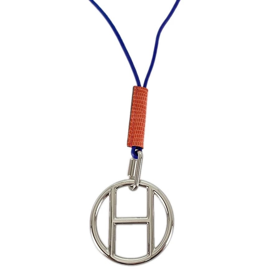 HERMES CURIOTITE LEATHER NECKLACE: HERMES Curiotite Leather Necklace Brand: HERMES Type: Necklace Material: Leather Stainless Steel Color: Blue Size: 47mm Necklace full length:78cm Accessories: None Accessories Notice: When