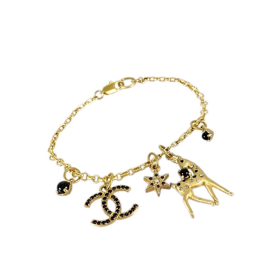 CHANEL GOLD PLATED RHINESTONE BRACELET: CHANEL Gold plated Rhinestone Bracelet Brand: CHANEL Type: Bracelet Material: Gold Plated Rhinestone Color: Gold Size: (COCO Mark):13.5mm×18.4mm Motif (deer):30.7mm×14.1mm Motif (star):13.5mm×9