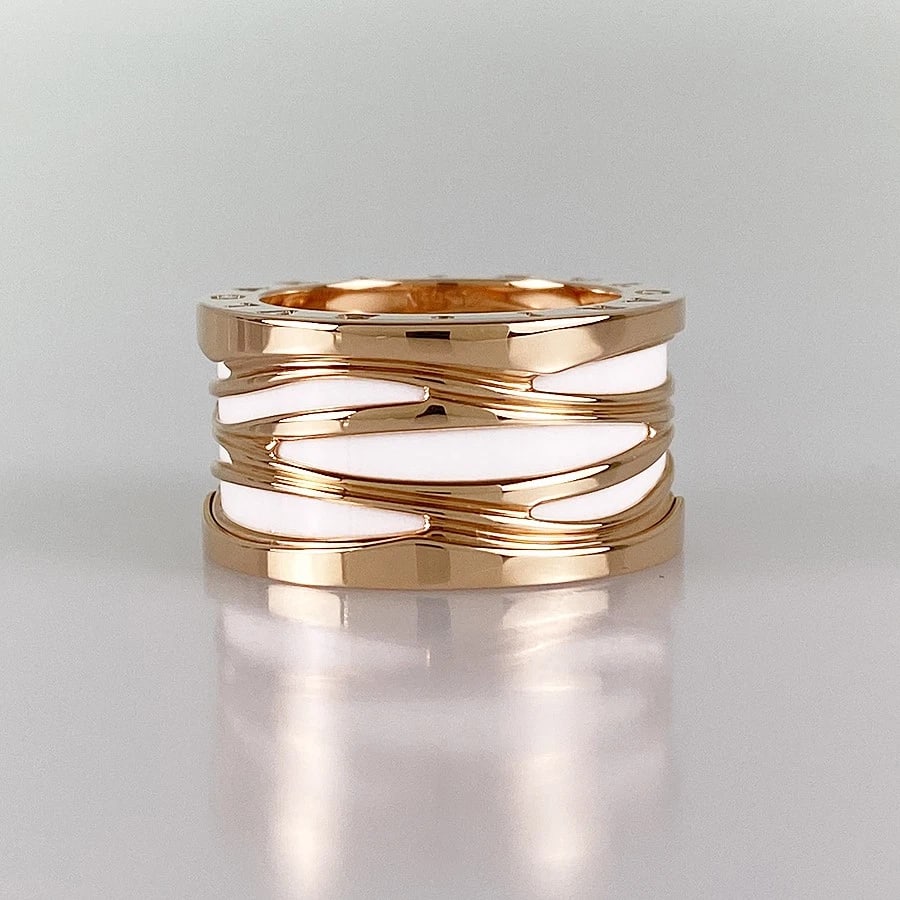 BVLGARI B.ZERO1 LEGEND ROSE GOLD RING: BVLGARI B.zero1 legend Rose gold Ring Brand: BVLGARI Type: Ring Material: 18K Rose Gold Ceramic Color: Rose Gold Size: US:7 Accessories: None Accessories Notice: When purchasing pre-owned