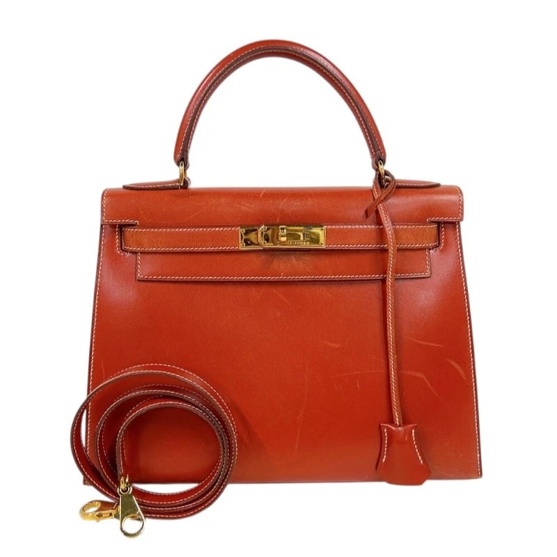 HERMES KELLY 28 OUTER SEWING SHOULDER BAG: HERMES Kelly 28 outer sewing Shoulder Bag Brand: HERMES Type: Shoulder Bag Material: Box scarf Color: Brick GoldHardware Size: W11.0 x H8.5x D4.7inch Shoulder:34.6inch Accessories: None