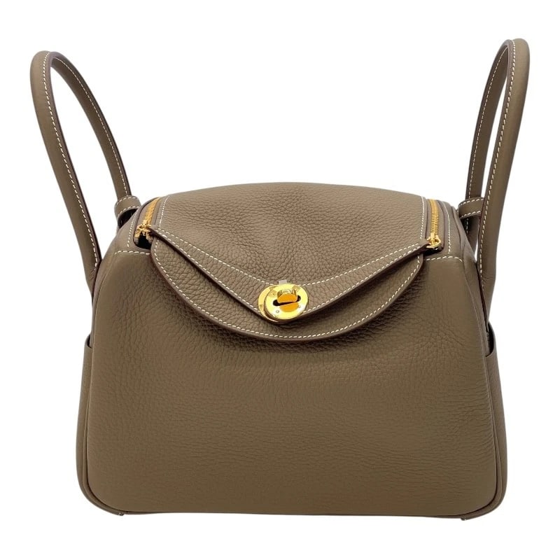 HERMES LINDY 26 SHOULDER BAG: HERMES Lindy 26 Shoulder Bag Brand: HERMES Type: Shoulder Bag Material: Taurillon Clemence Color: Etup Gold Hardware Size: W10.2 x H7.1x D5.1inch Accessories: None Accessories Notice: When