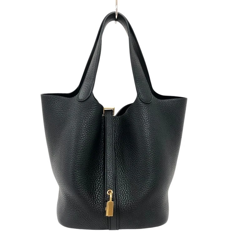 HERMES PICO TAN LOCK MM HANDBAG: HERMES Pico Tan Lock MM Handbag Brand: HERMES Type: Handbag Material: Taurillon Clemence Color: Black Gold Hardware Size: W8.7 x H8.3x D6.7inch Accessories: None Accessories Notice: When p