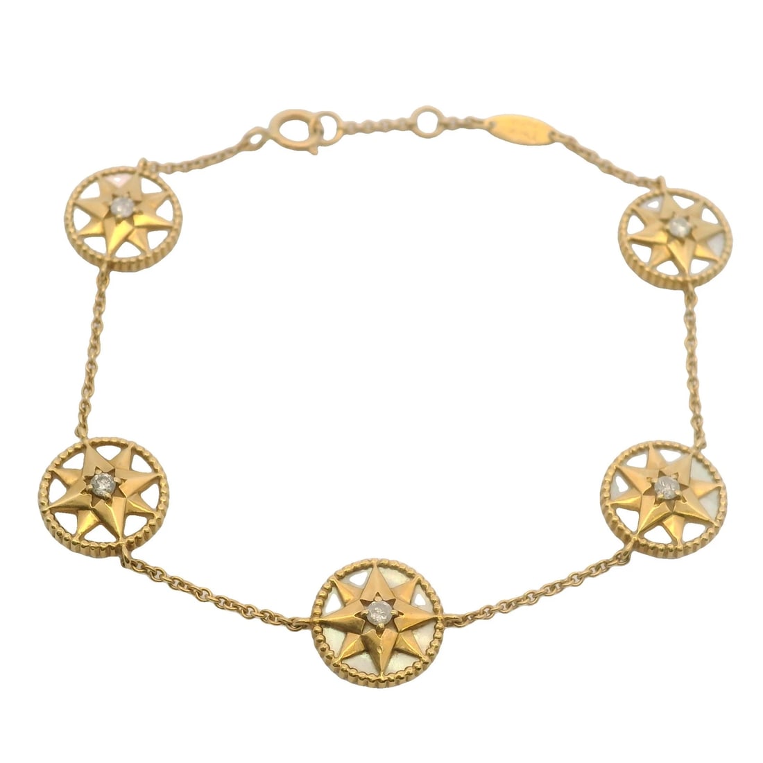 RETIRED CHRISTIAN DIOR 18KT YELLOW GOLD ROSE DES VENTS MOTHER OF PEARL BRACELET: Retired Christian Dior 18kt Yellow Gold Rose des Vents Mother of Pearl Bracelet Brand: Dior Type: Bracelet Material: Yellow Main Stone Natural Color: Yellow Gold 18k Size: Length - 7" Width - 11mm
