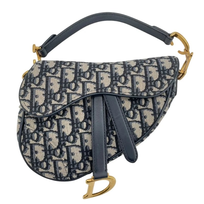 CHRISTIAN DIOR SADDLEBAG MINI HANDBAG: Christian Dior saddlebag mini Handbag Brand: Christian Dior Type: Handbag Material: oblique canvas Color: IvoryxNavy GDHardware Size: W7.5 x H5.1x D2.4inch Accessories: None Accessories No