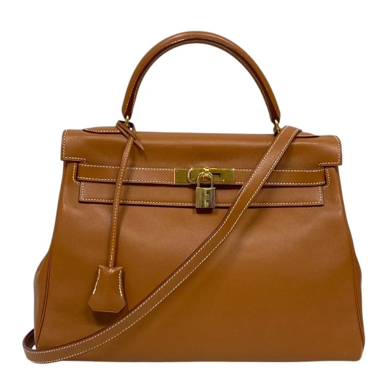 HERMES KELLY 32 INTERNAL SEWING HANDBAG: HERMES Kelly 32 internal sewing Handbag Brand: HERMES Type: Handbag Material: Gulliver Color: Gold Gold Hardware Size: W12.2 x H9.1x D3.9inch Shoulder:35.4inch Accessories: None Accessorie