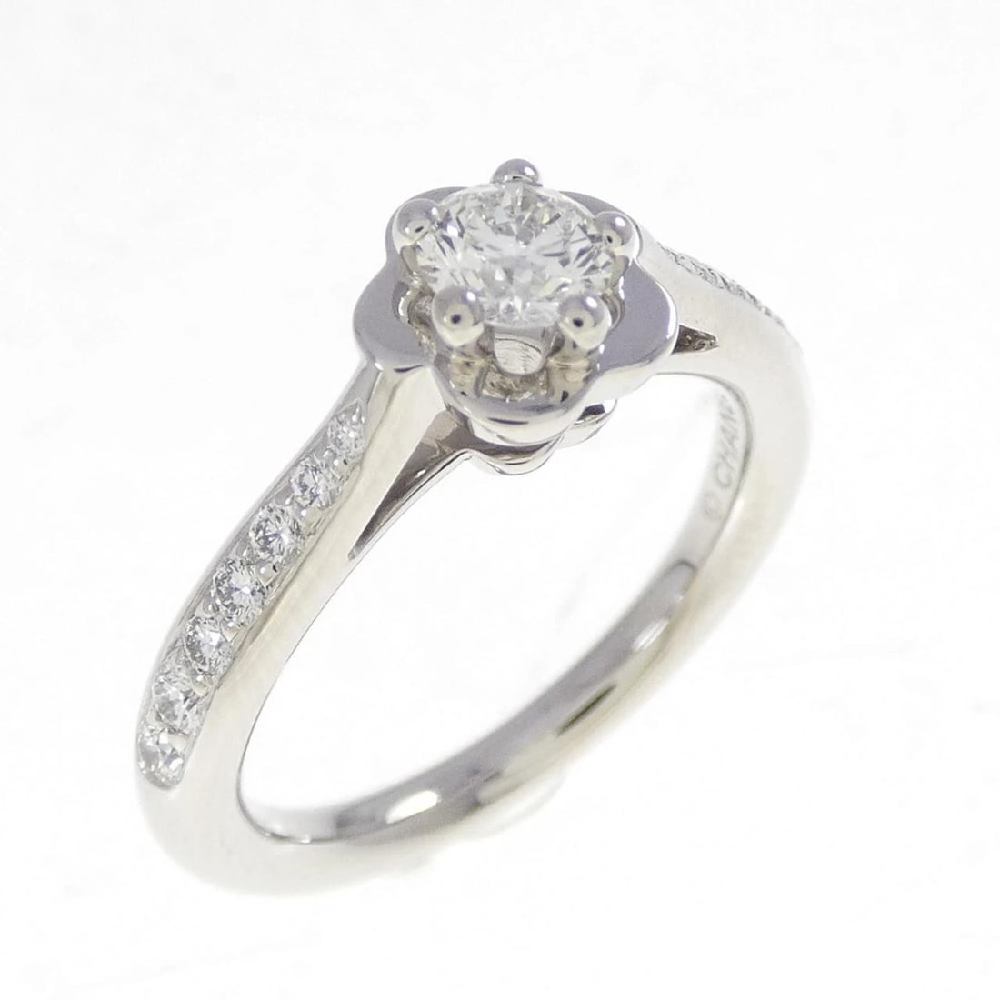 CHANEL CAMELLIA RING: Chanel Camellia Ring Brand: CHANEL Type: Ring Material: Platinum 950 Main Stone Natural Color: F Clarity VVS1 Size: 4.5-5 (US size) Accessories: None Accessories Notice: When purchasing